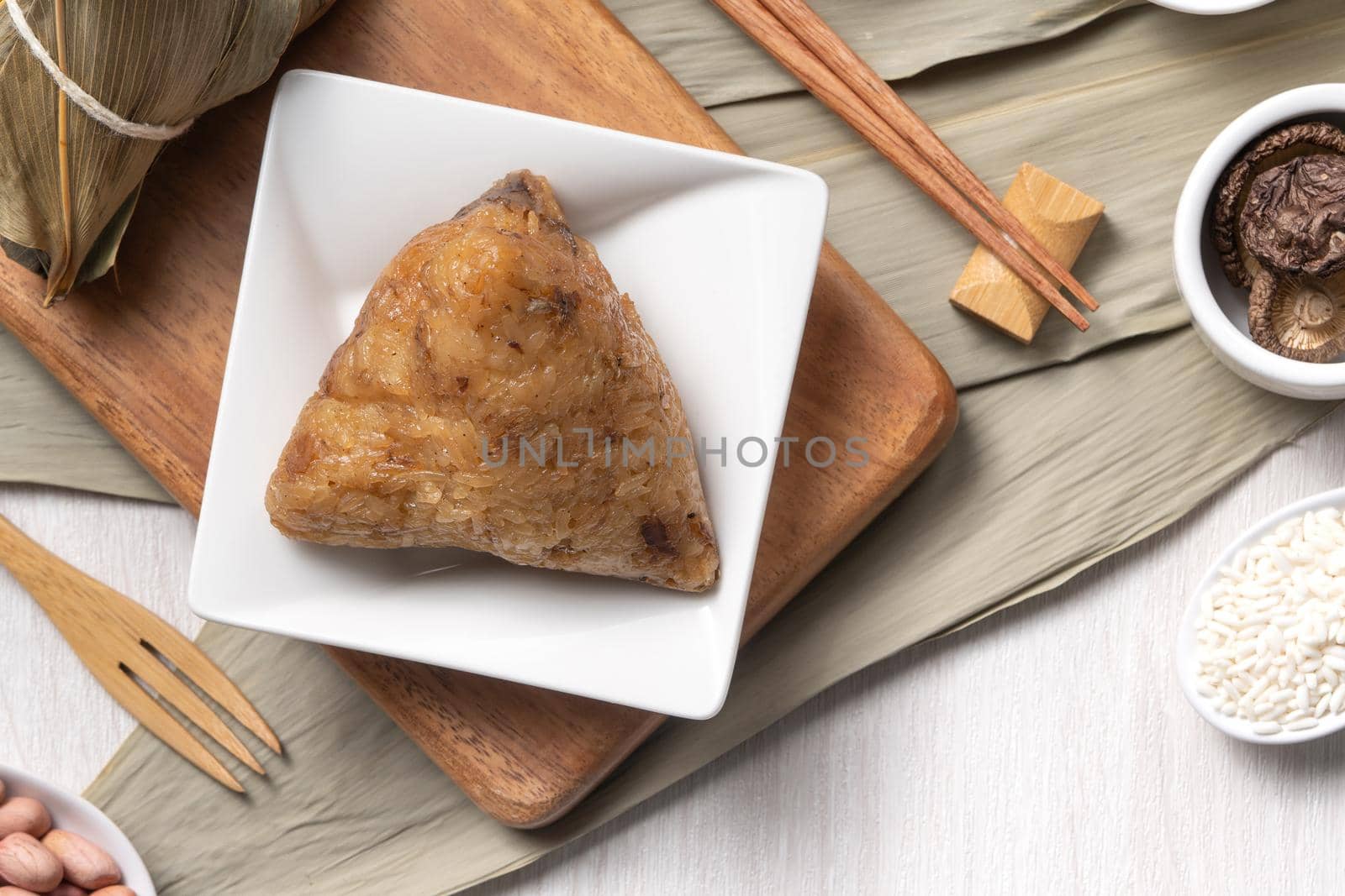 Zongzi. Delicious traditional rice dumpling food for Dragon Boat Duanwu Festival over wooden table background top view.