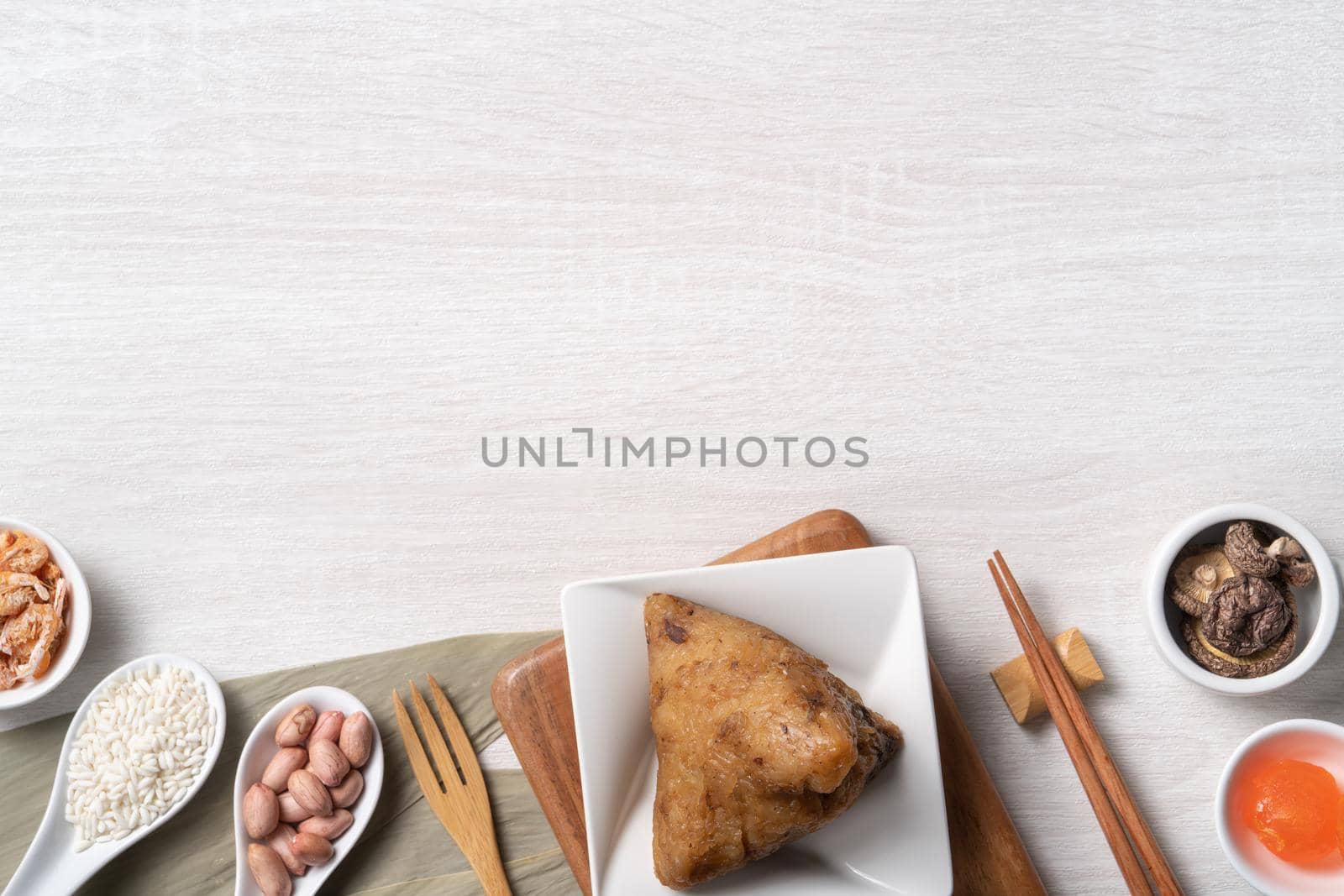 Zongzi. Delicious traditional rice dumpling food for Dragon Boat Duanwu Festival over wooden table background top view.
