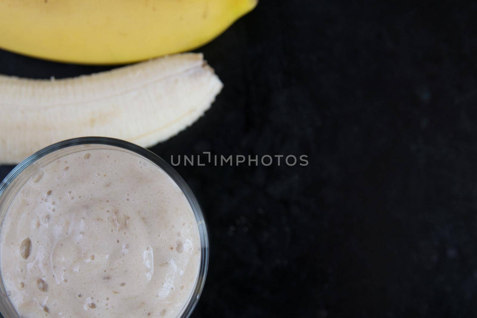 banana smoothie making process.healthy food for vegetarians by igor707