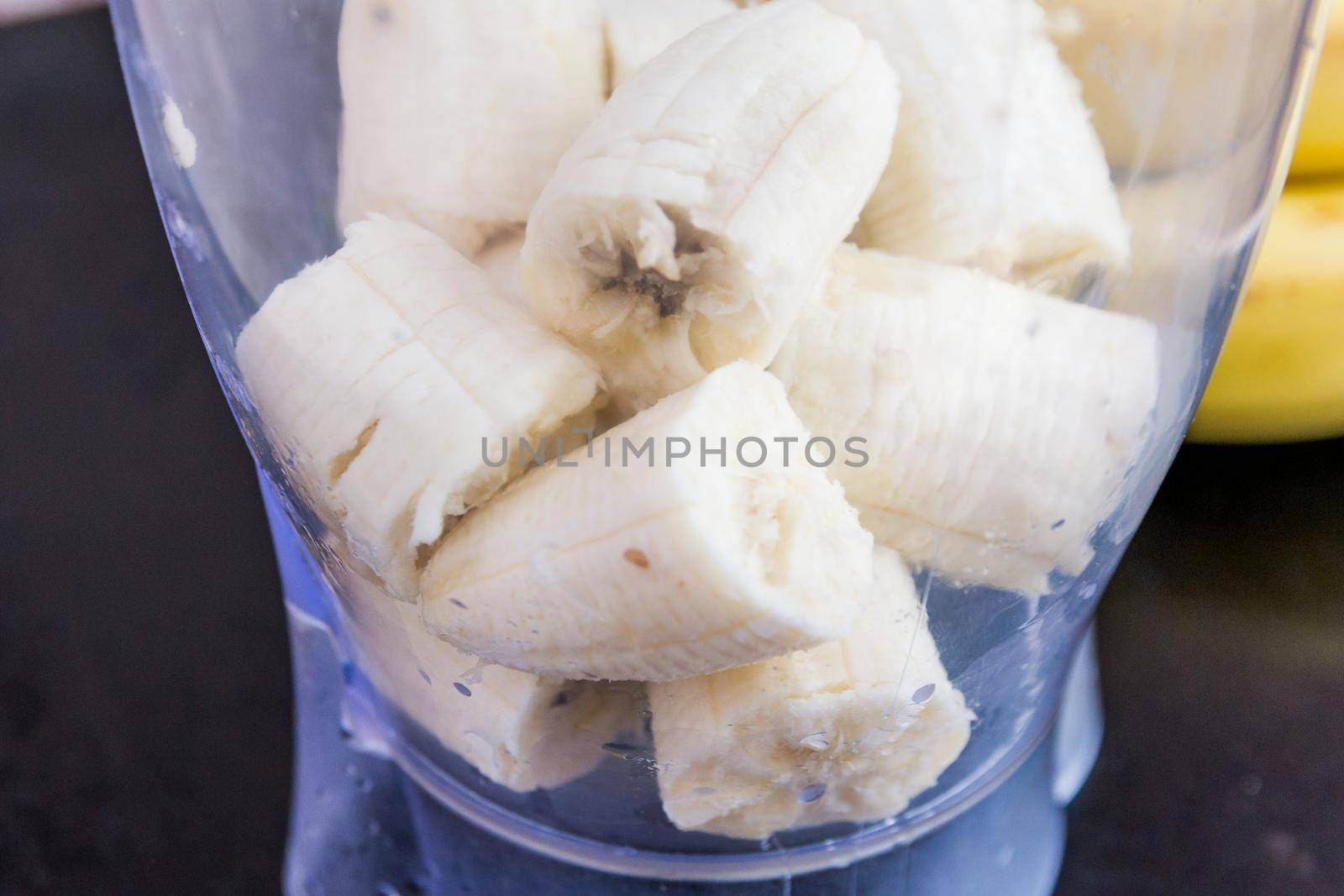 banana smoothie making process.diet food. healthy food for vegetarians