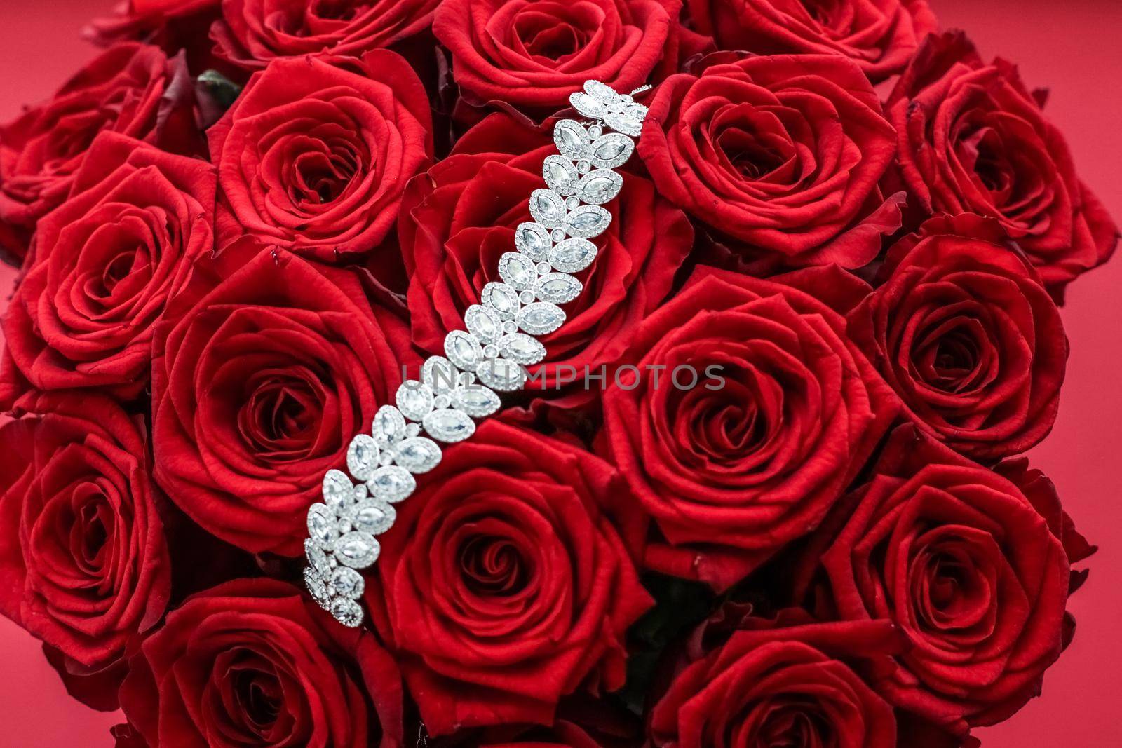 Gemstone jewellery, wedding fashion and luxe shopping concept - Luxury diamond bracelet and bouquet of red roses, jewelry love gift on Valentines Day and romantic holidays present