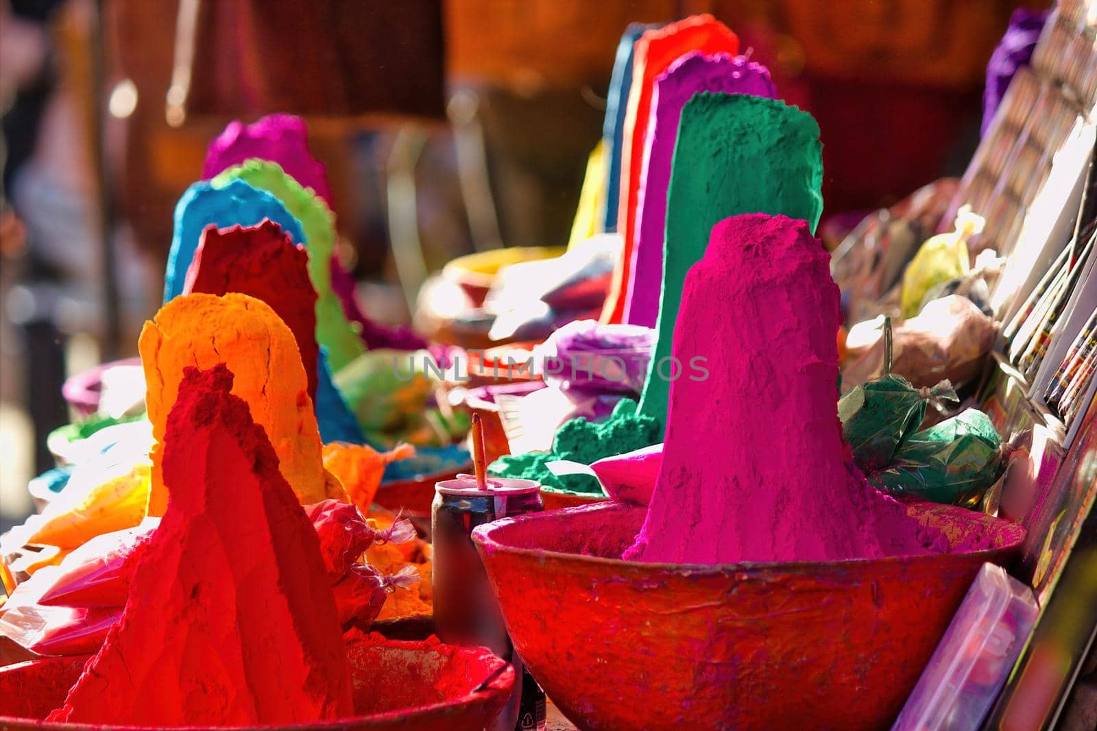 Shallow depth of field, Bunch of dry powder colors kept on display for sale in the commercial market of Pushkar fair