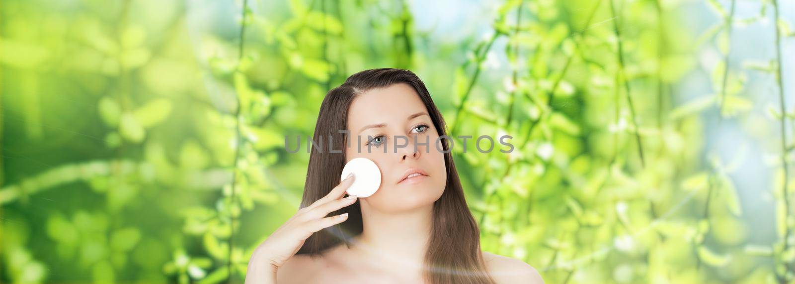 Beauty portrait of young woman for natural skincare and cosmetic brand, spring nature on background as wellness, health and organic beauty concept.