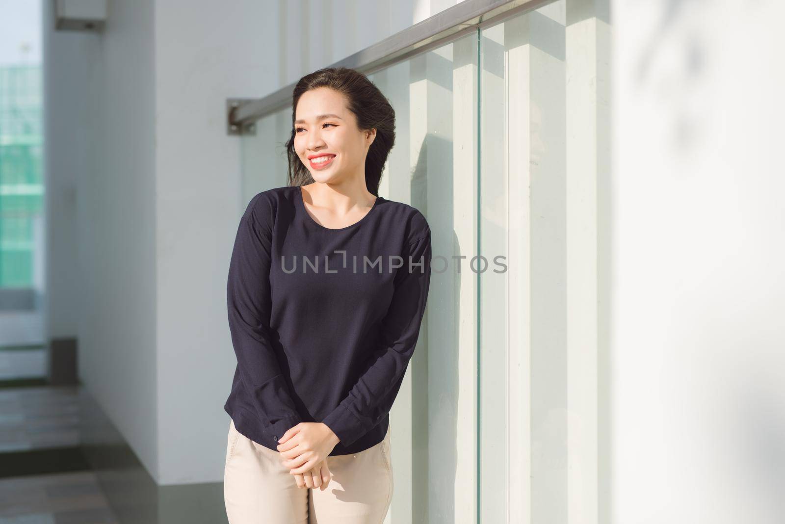 Beautiful asian woman relaxing in the terrace