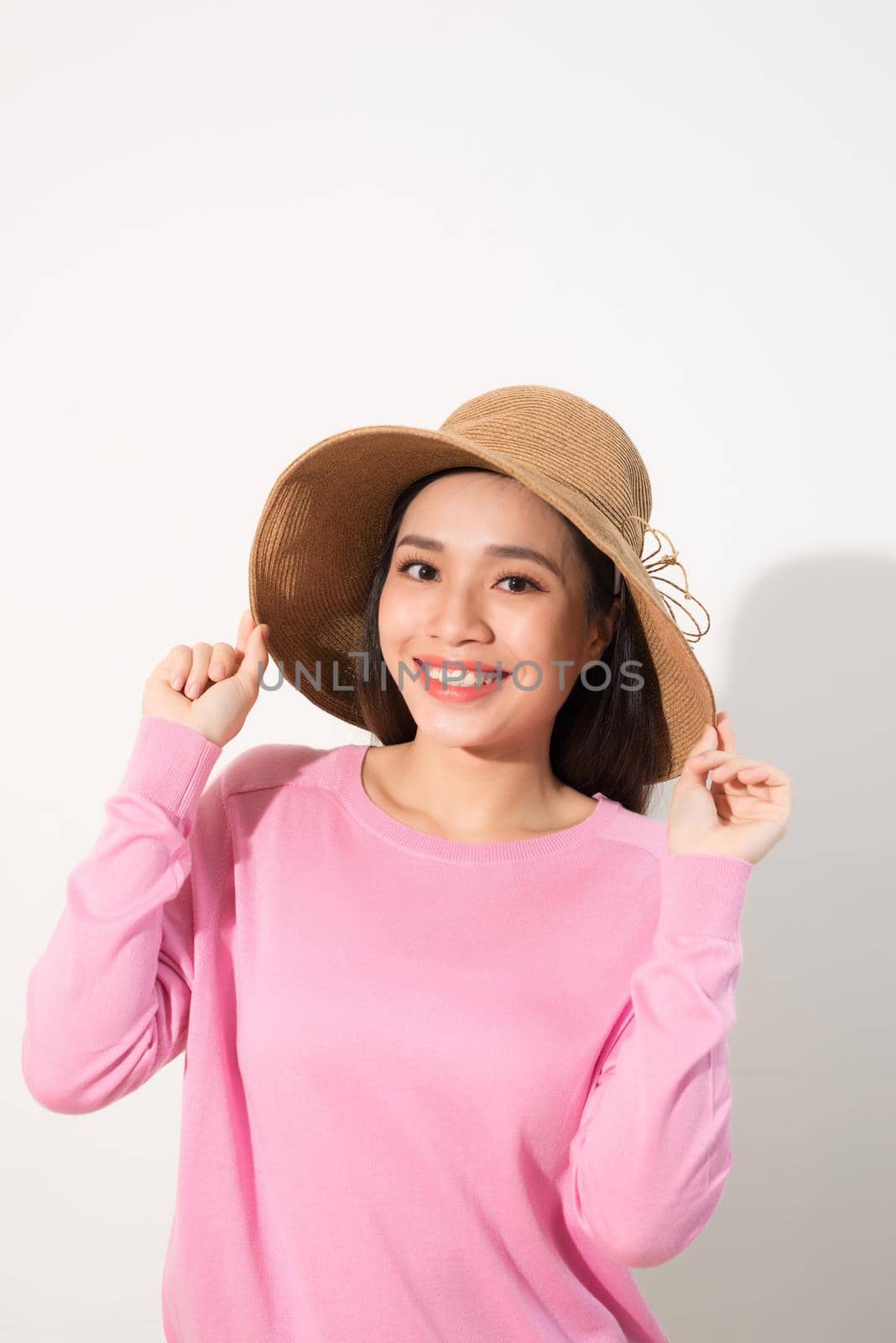 Portrait of a beautiful woman in a straw hat. Laughing girl. Summer time by makidotvn