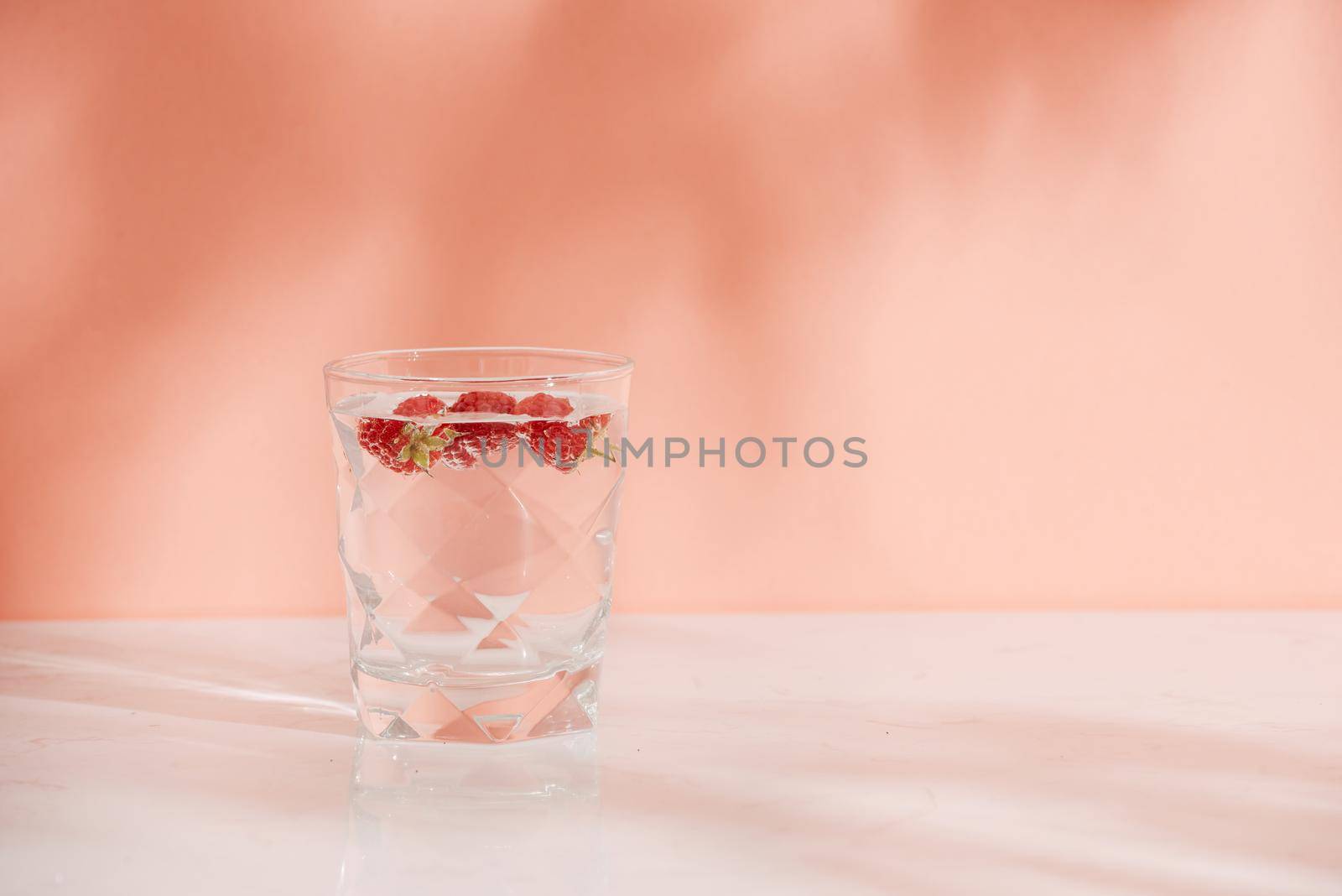 A glass of fresh soda with raspberries  by makidotvn