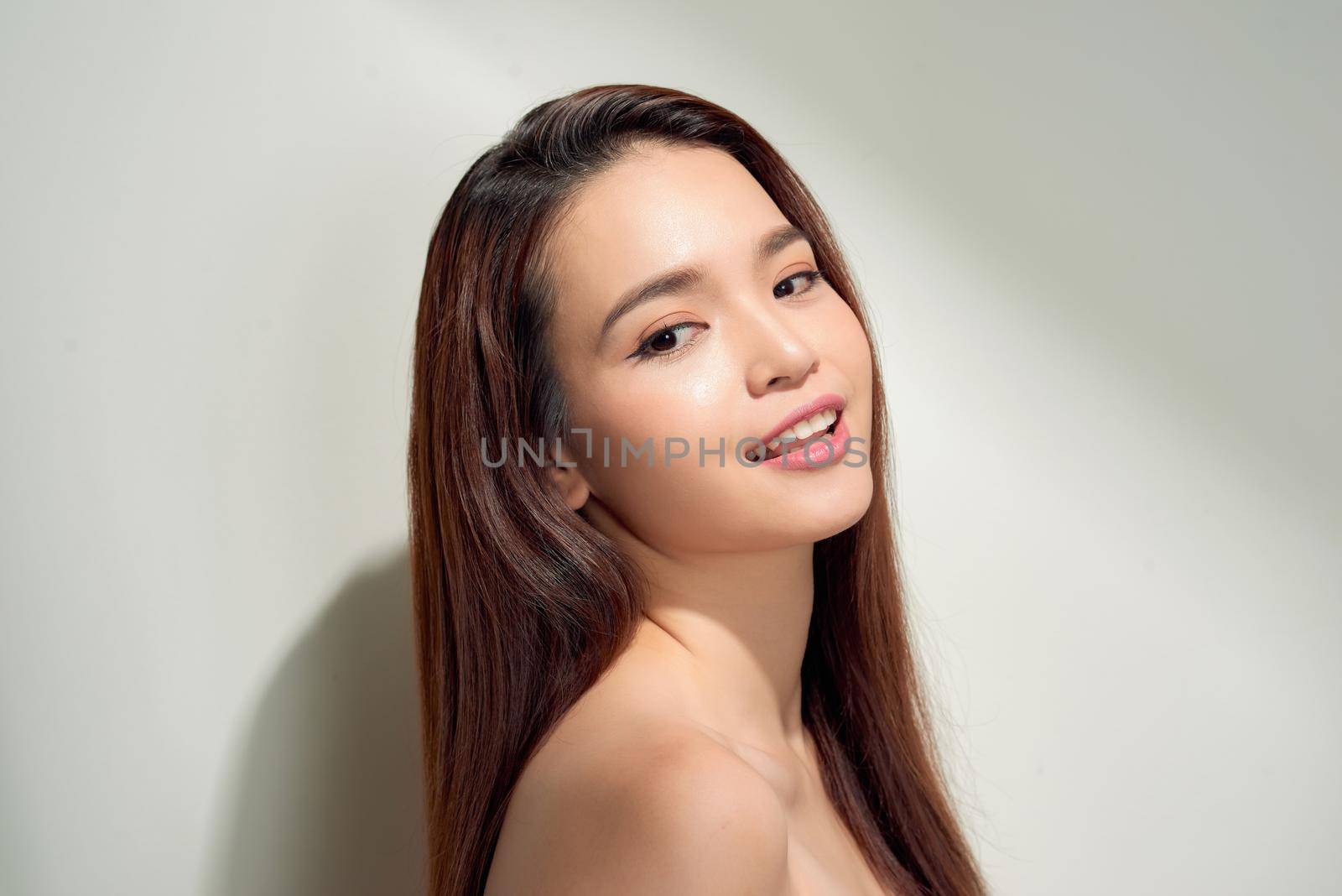 Beauty asian girl with long and shiny hair . Beautiful model woman with long hairstyle. Care and beauty