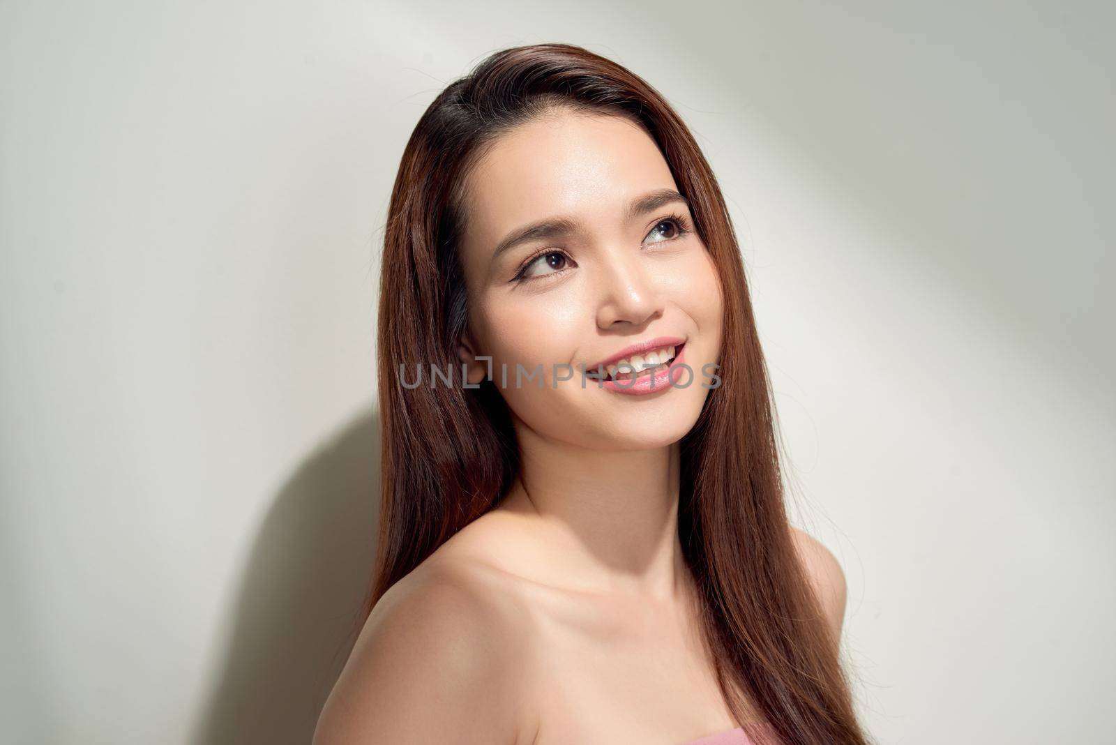 Beauty asian girl with long and shiny hair . Beautiful model woman with long hairstyle. Care and beauty