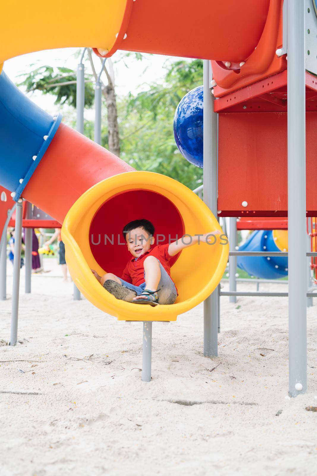 children playing on playground in summer outdoor park by makidotvn