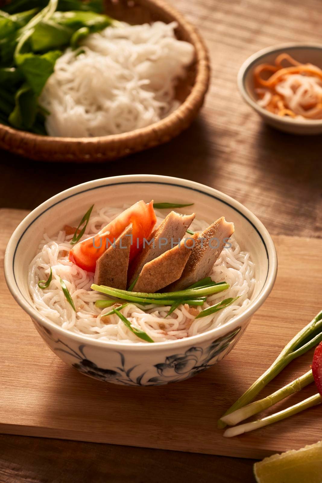 Vietnamese soup containing rice vermicelli and grilled chopped fish