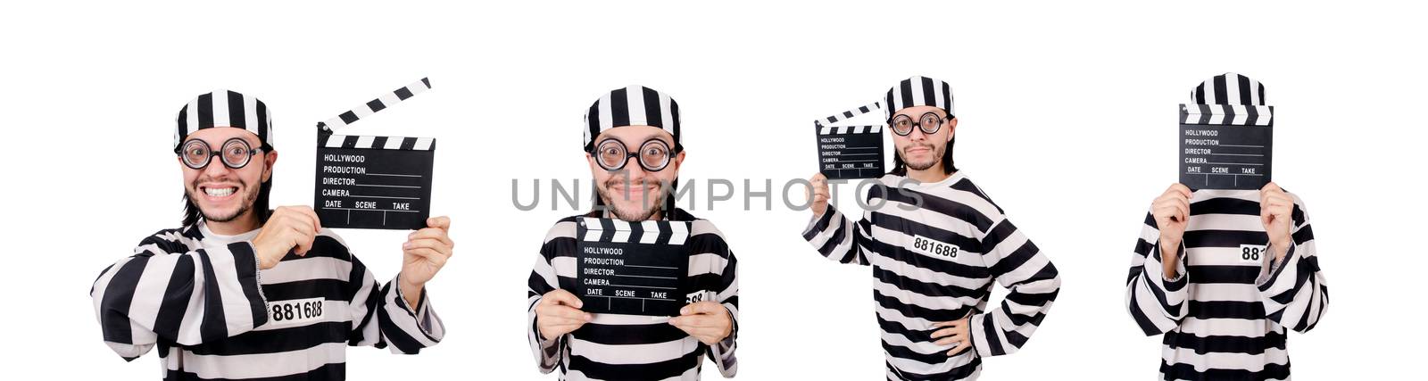 Funny prison inmate with movie board isolated on white