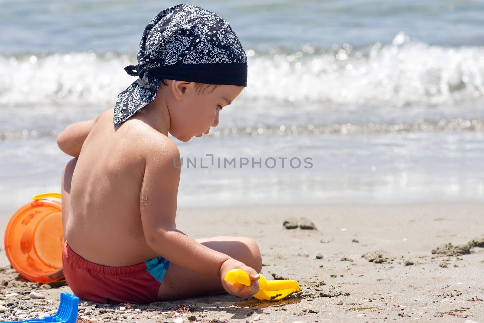 Boy playing on beach by palinchak