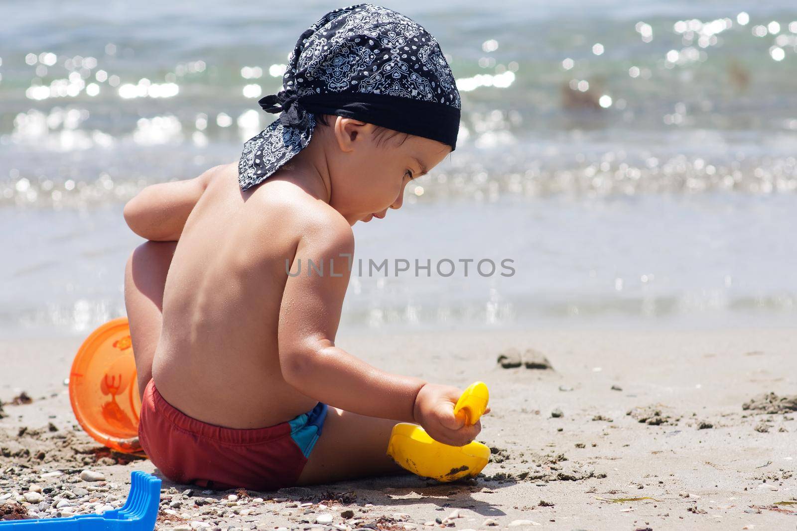 Boy playing on beach by palinchak