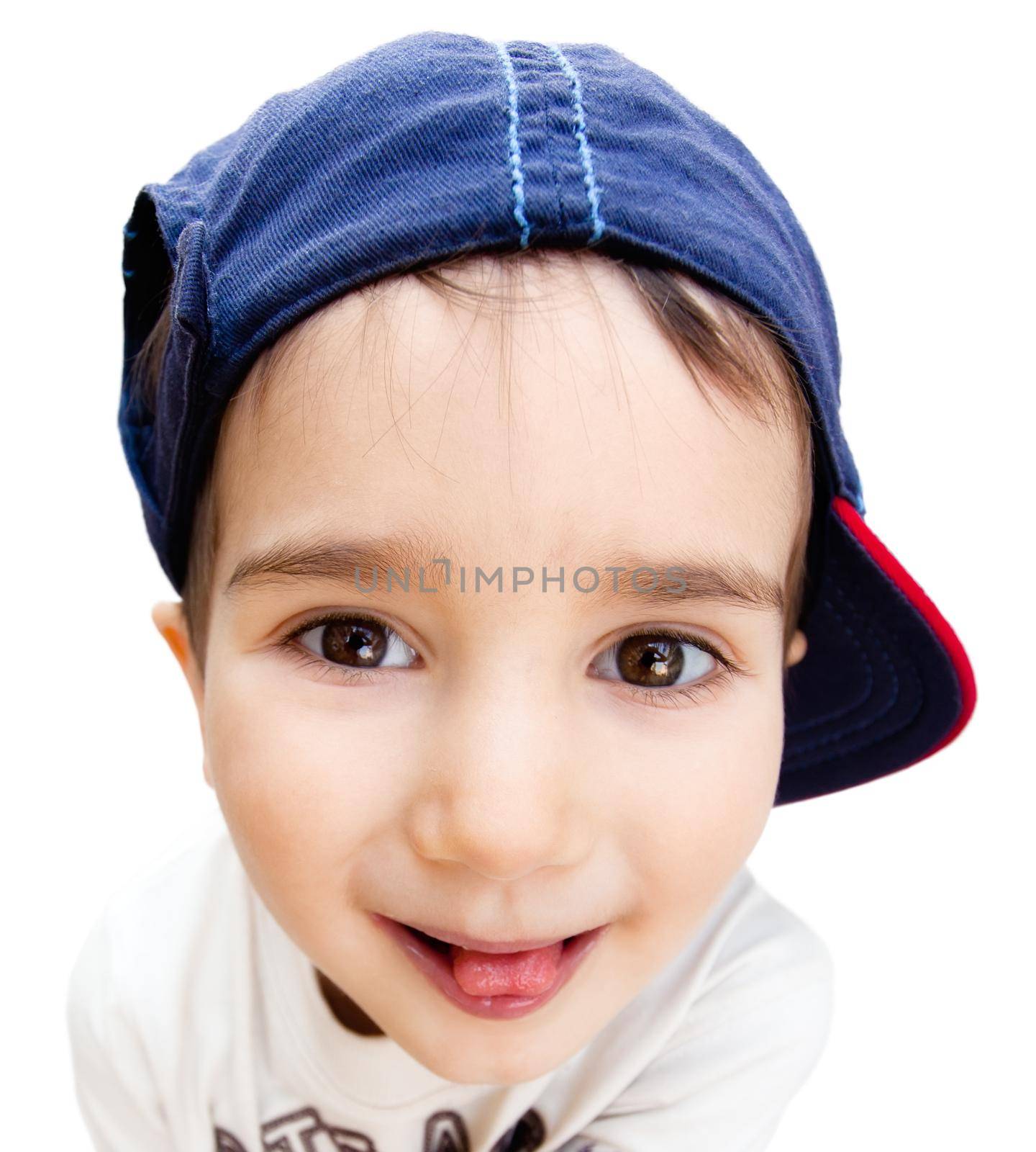 Portrait of a boy wearing a cap with a tongue isolated on white
