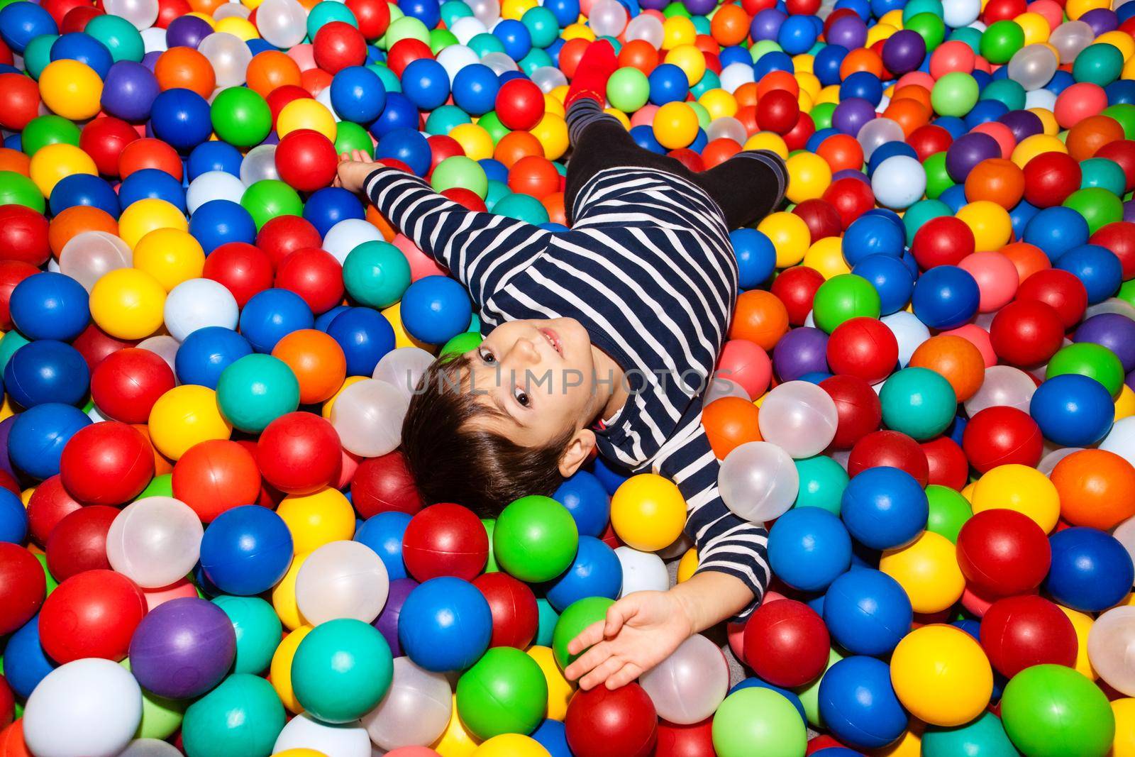 Little boy playing with balls