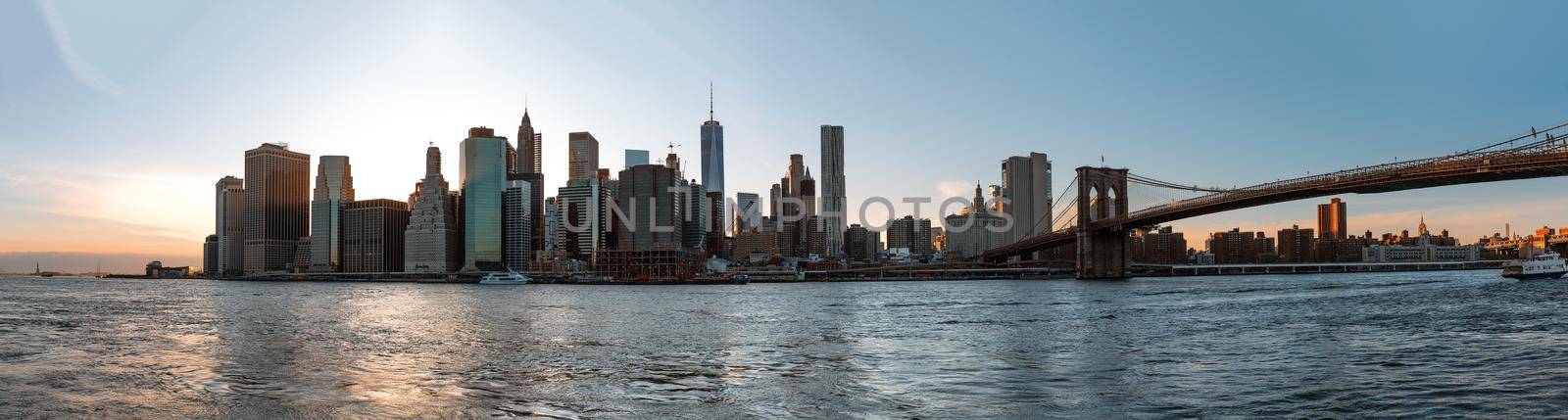 Panorama of Manhattan Skyline at evening seen from Brooklyn Bridge Park, New York City, USA