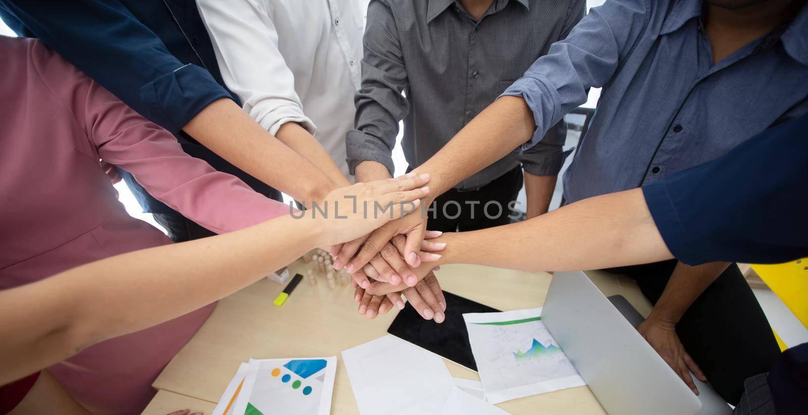 business people hands fist joined together as unity.