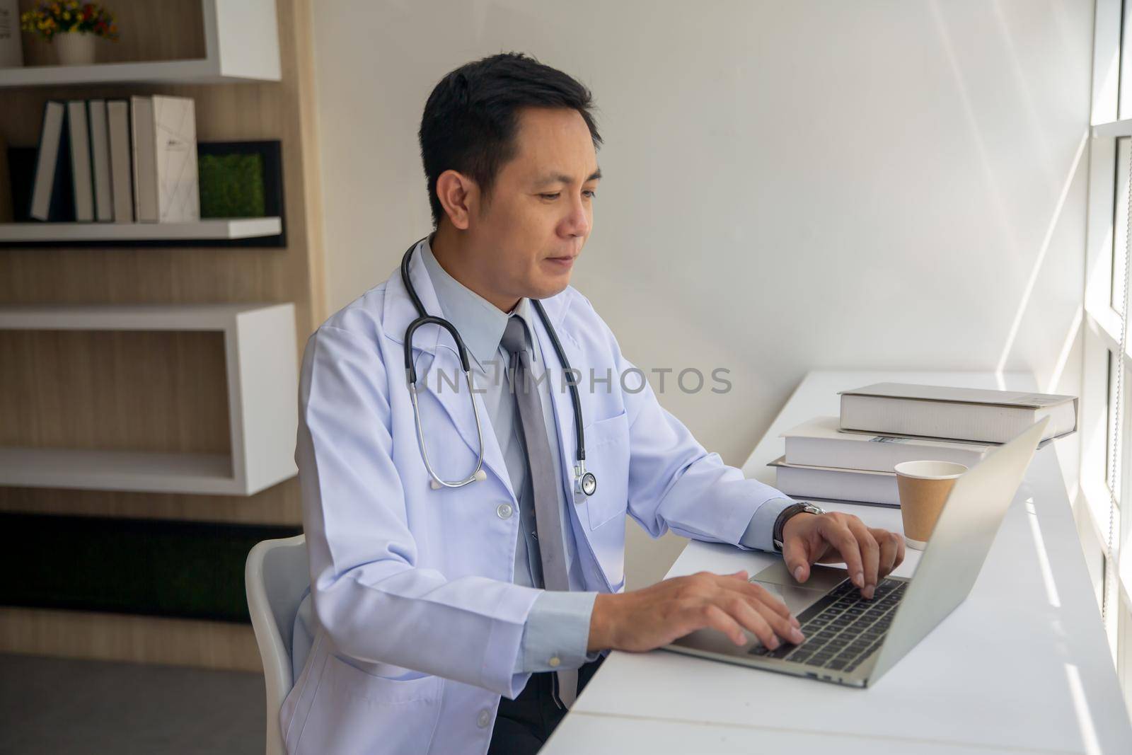 Professional medical doctors working in hospital office using computer technology. Medicine and healthcare.