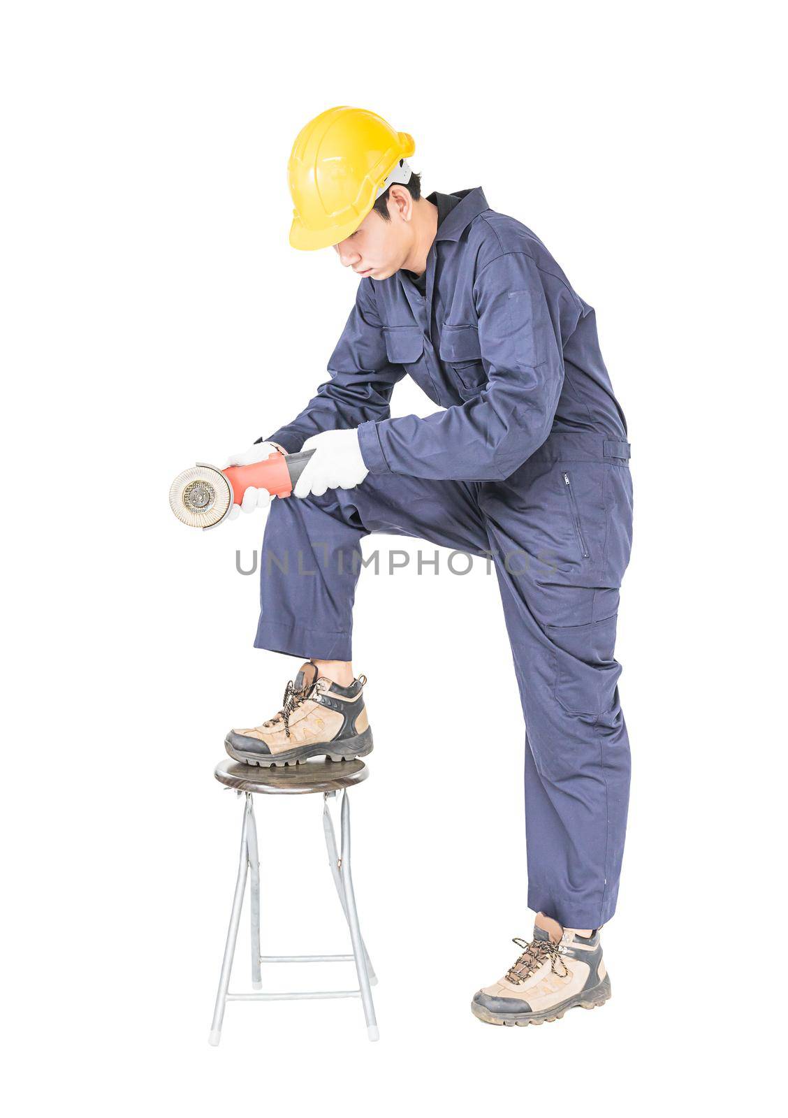Young handyman in uniform hold grinder, Cutout isolated on white background