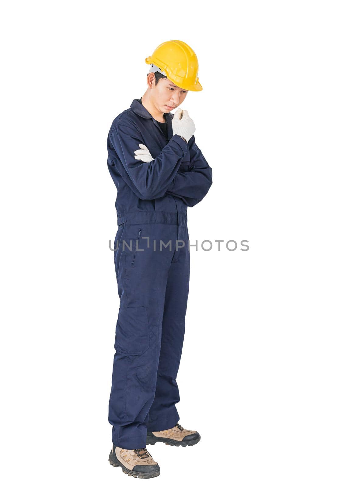 Workman with blue coveralls and hardhat in a uniform with clipping path by stoonn