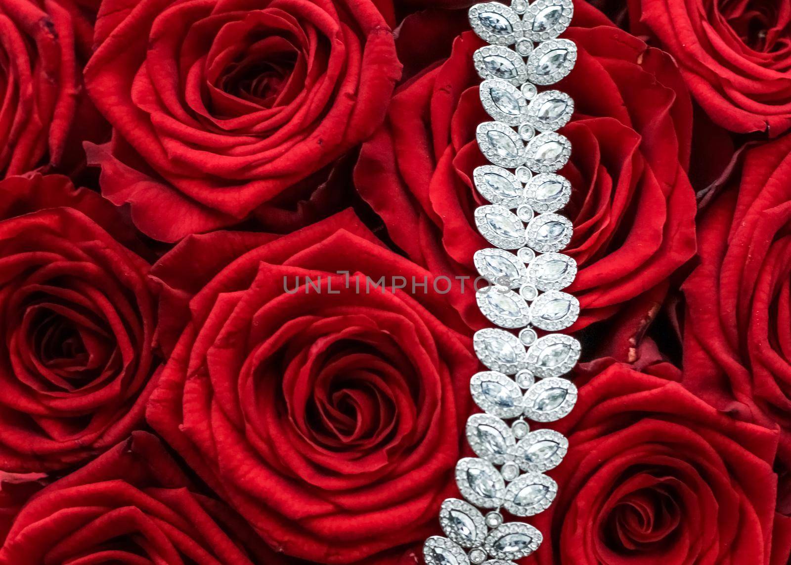 Gemstone jewellery, wedding fashion and luxe shopping concept - Luxury diamond bracelet and bouquet of red roses, jewelry love gift on Valentines Day and romantic holidays present