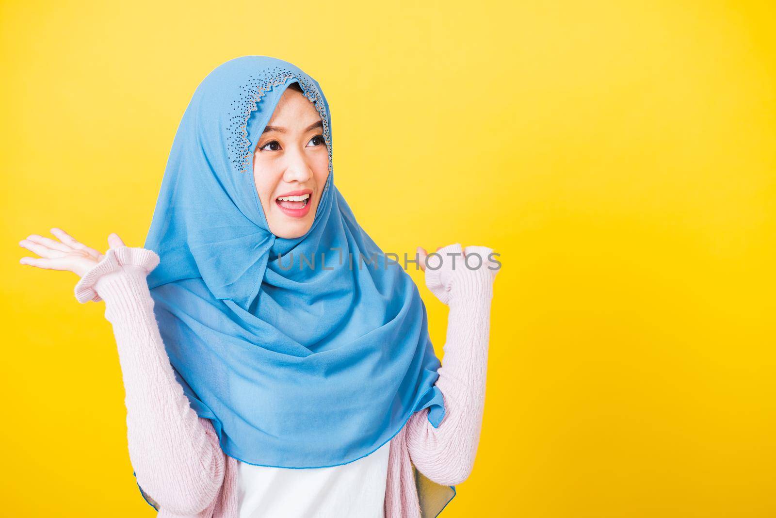 Asian Muslim Arab woman Islam wear veil she victories expression raises hands glad excited cheerful by Sorapop