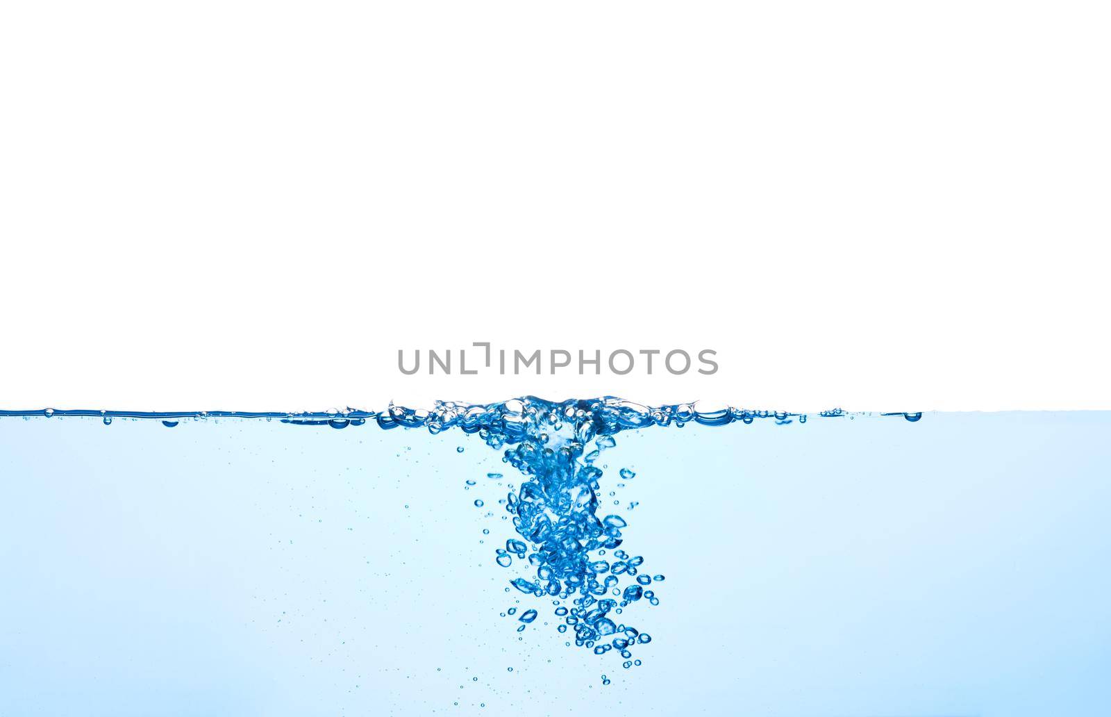 Light blue water wave with air bubbles and a little bit splashed underwater, studio shot isolated on white background. The abstract clean surface on liquid