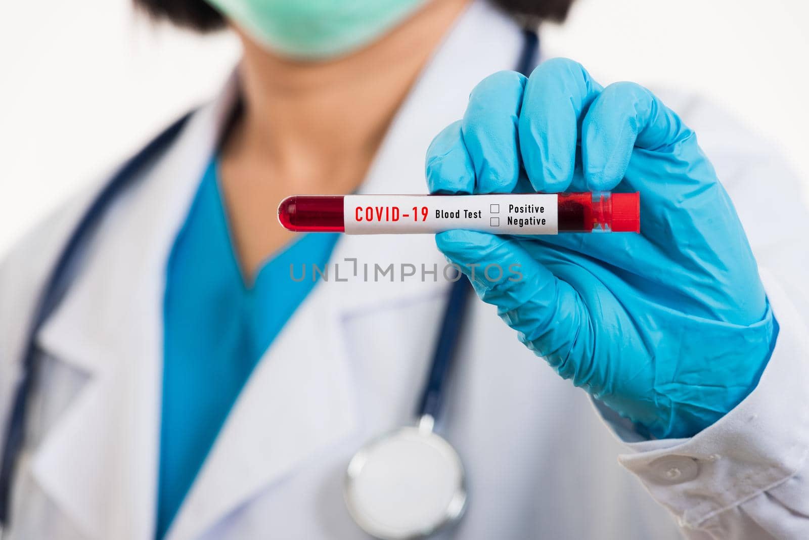 Doctor scientist in white uniform wear a mask holding test tube Coronavirus test blood sample in a clinical laboratory for analyzing isolated on white, medicine COVID-19 pandemic outbreak concept