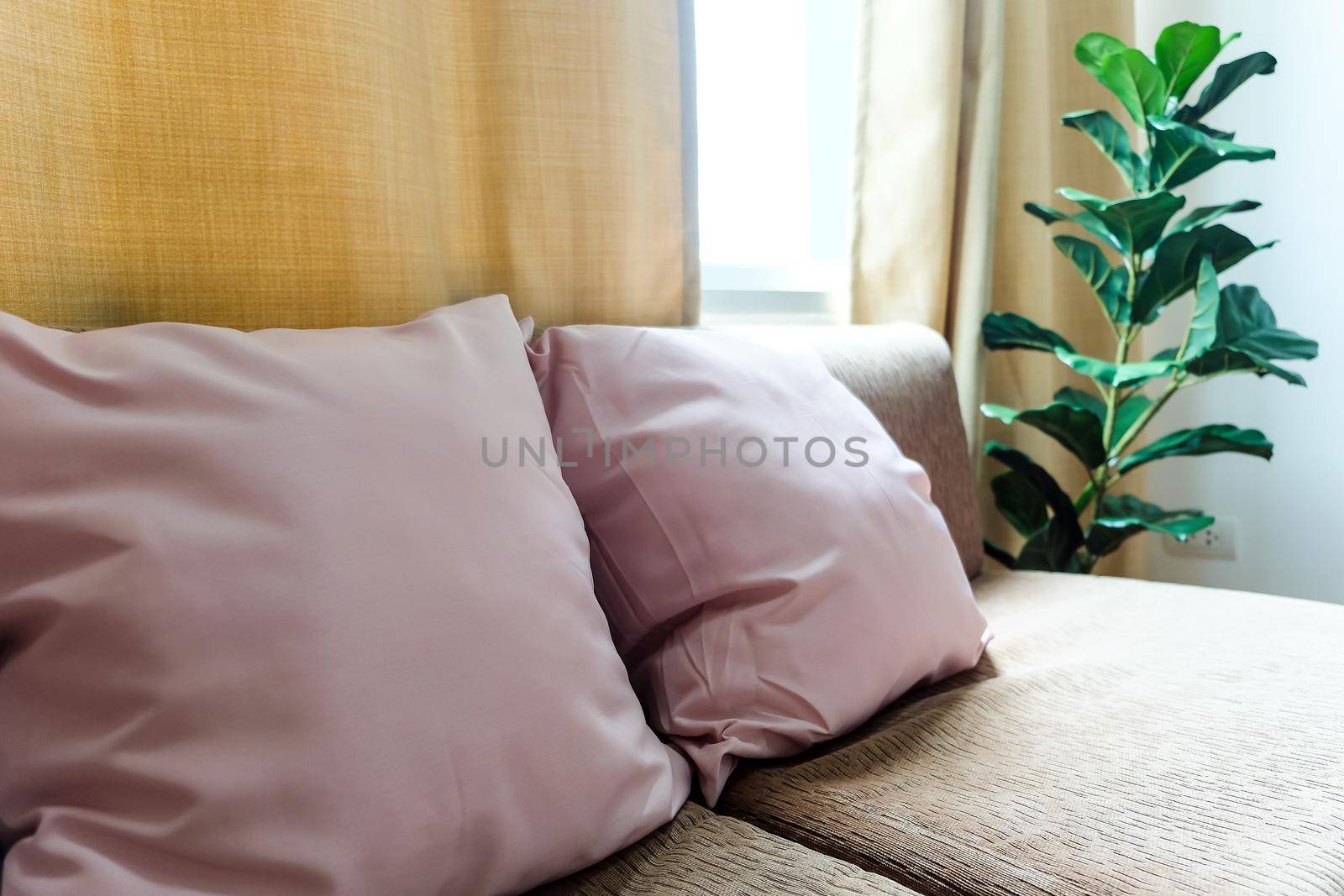 Interior decor, artificial plant decoration in bedroom.