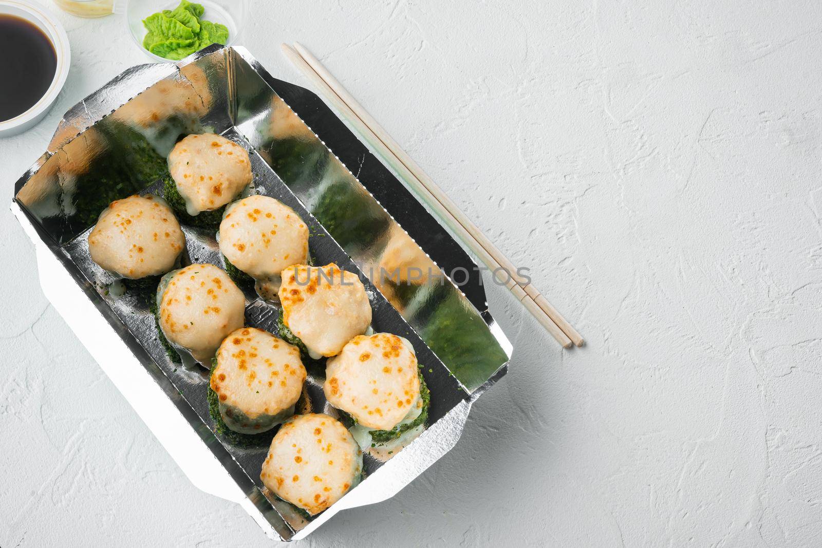 Sushi roll delivery set, on white stone background , with copyspace and space for text