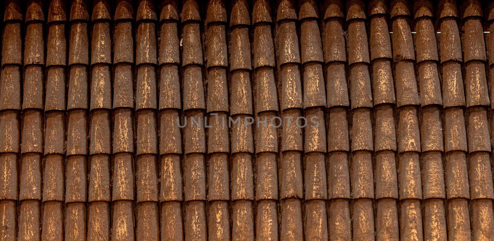 Traditional roof covered with brown  tiles made of wood
