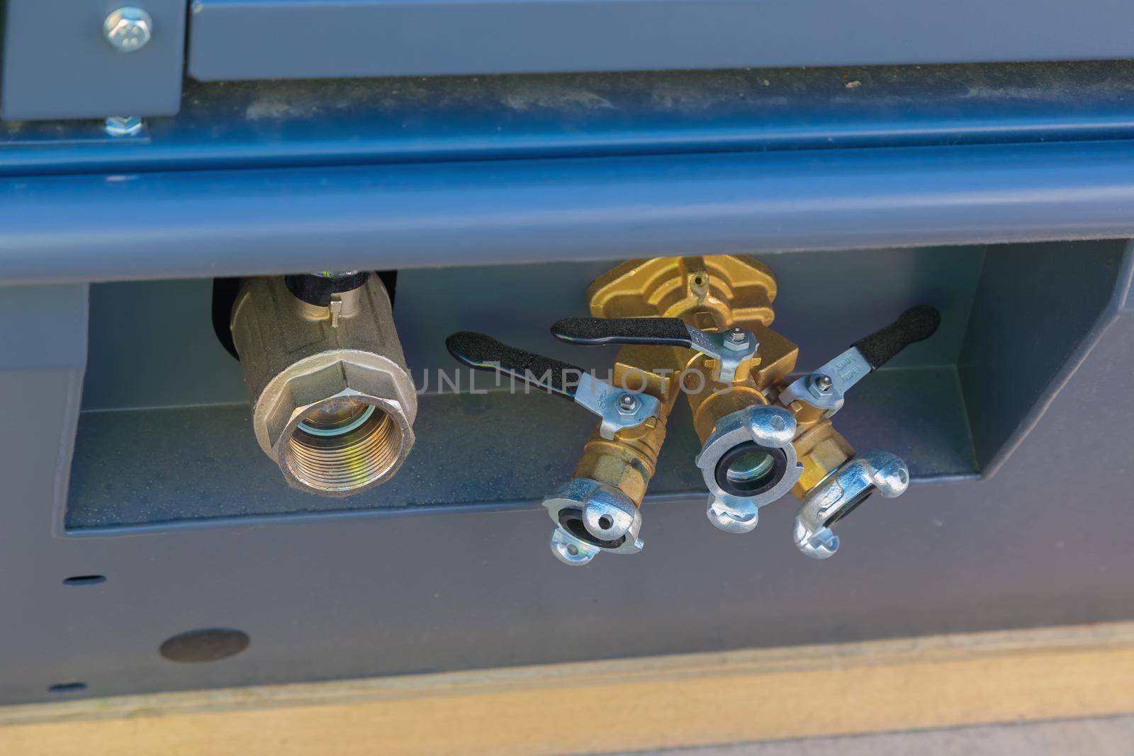 Outlet ball valves on an air compressor close-up.