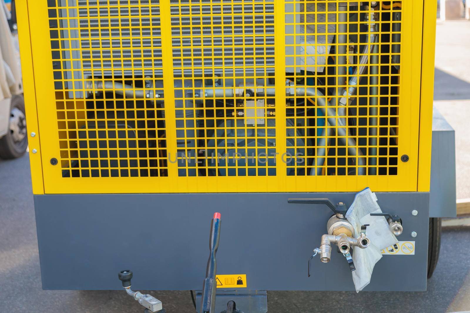 Mobile diesel compressor on wheels for supplying pneumatic air to devices.