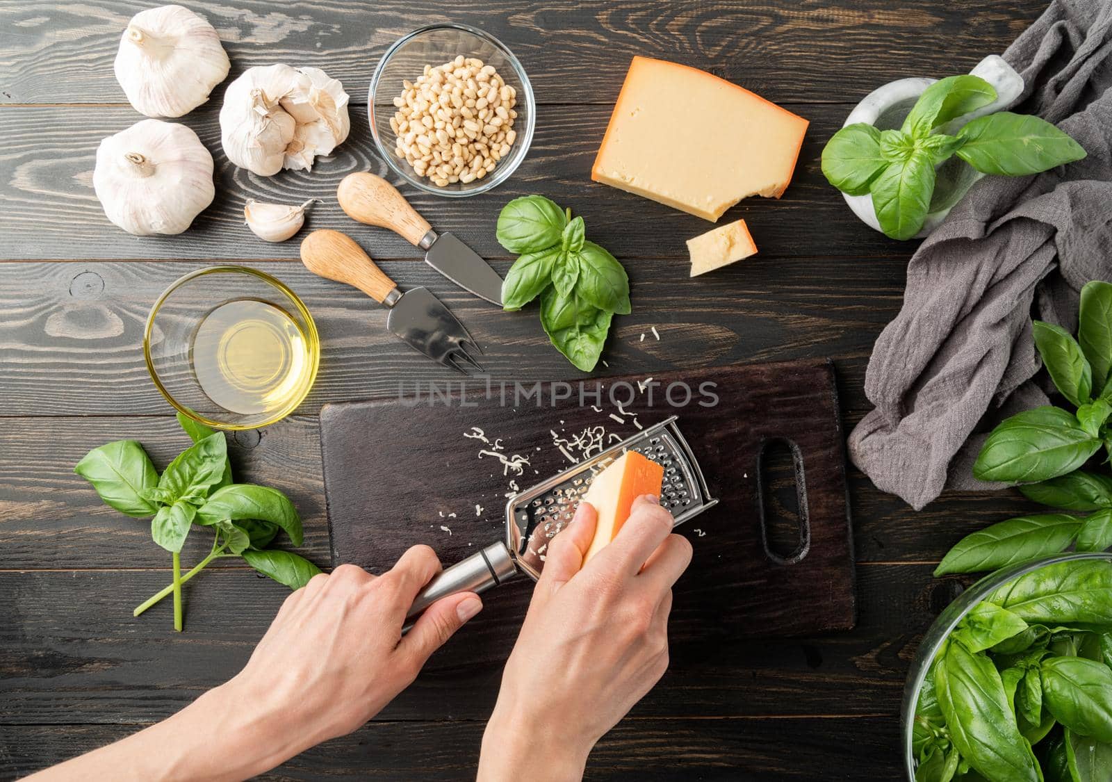 Italian Cuisine. Step by step cooking italian pesto sauce. Step 3 - grating parmesan cheese