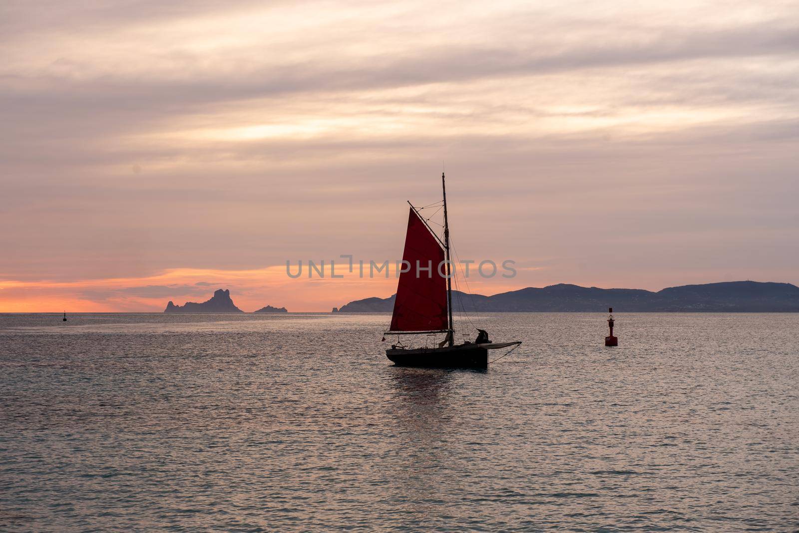 Sailing boat on the Island of Formentera in the summer of 2021 with Es Vedra behind.