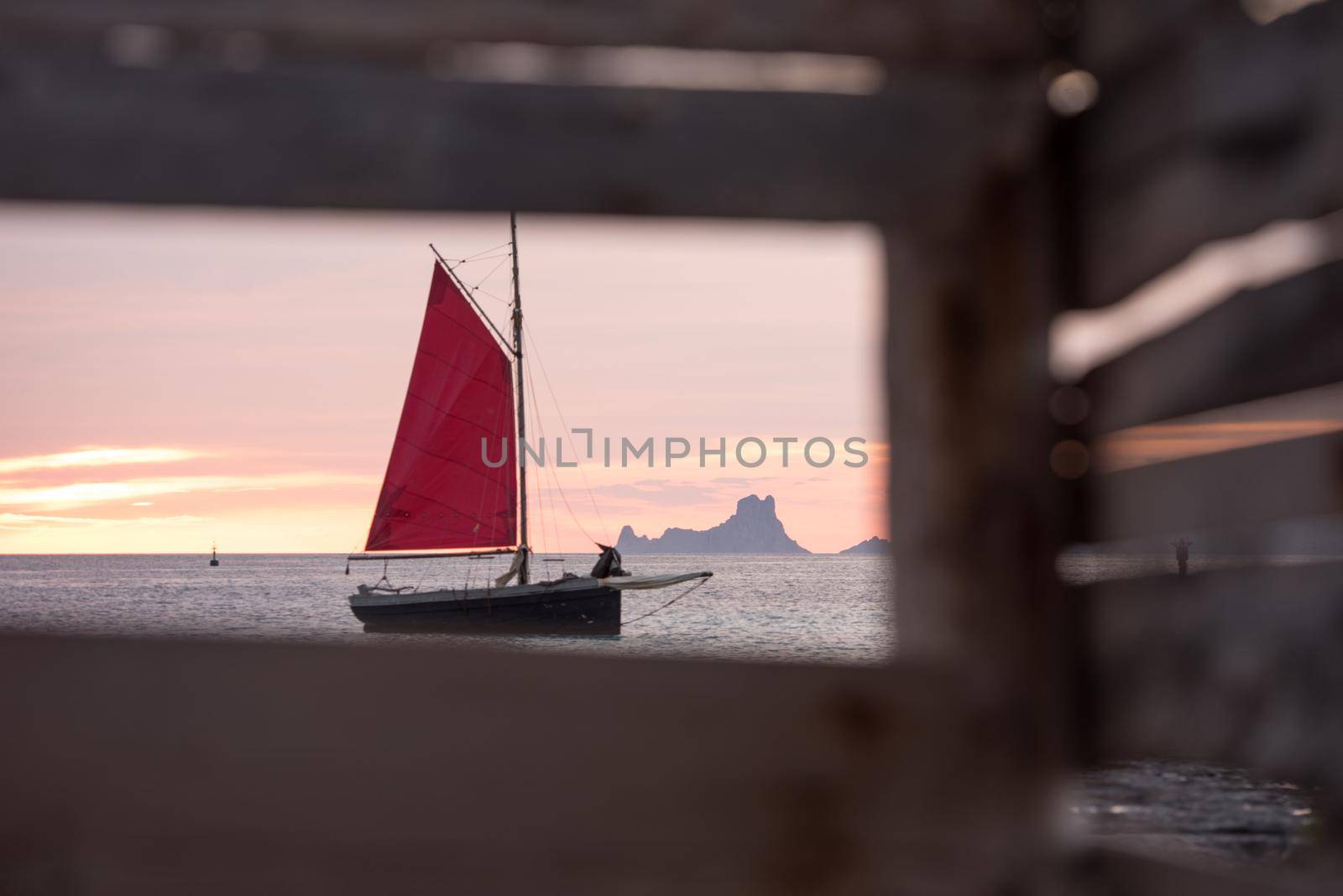 Sailing boat on the Island of Formentera in the summer of 2021 with Es Vedra behind.