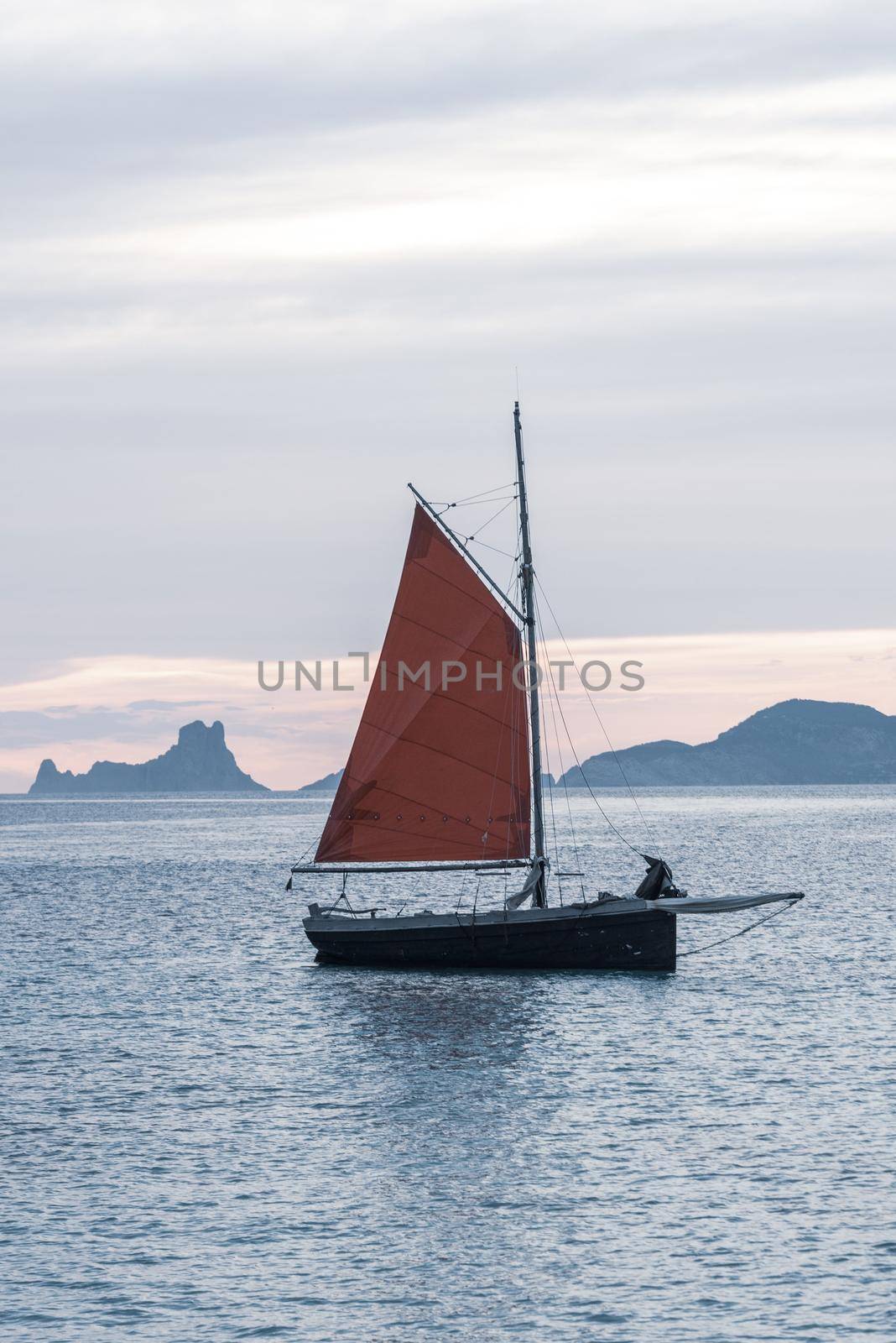 Sailing boat on the Island of Formentera in the summer of 2021 with Es Vedra behind.