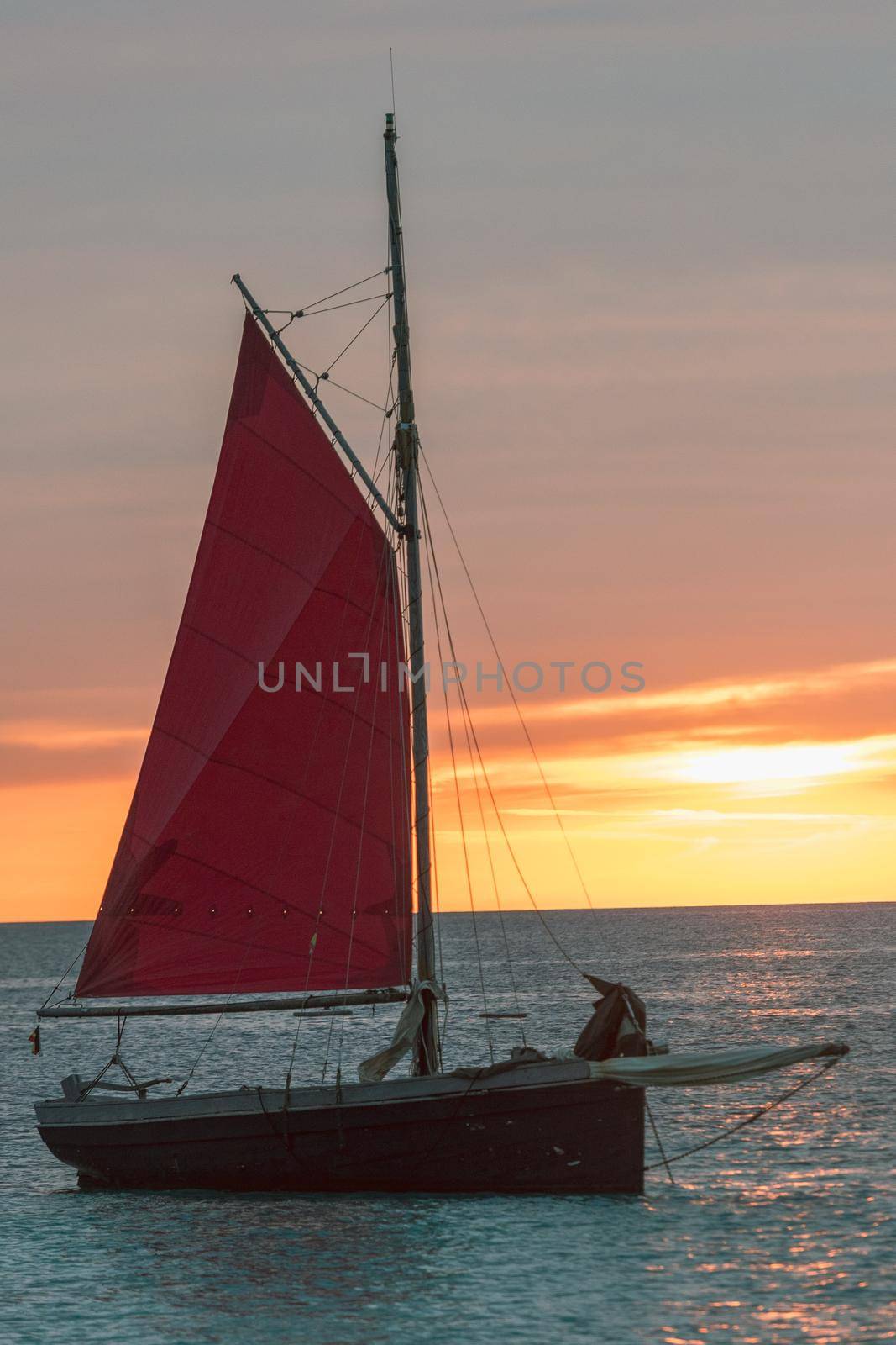 Sailing boat on the Island of Formentera in the summer of 2021 with Es Vedra behind.