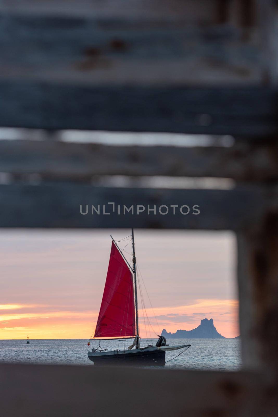 Sailing boat on the Island of Formentera in the summer of 2021 with Es Vedra behind.