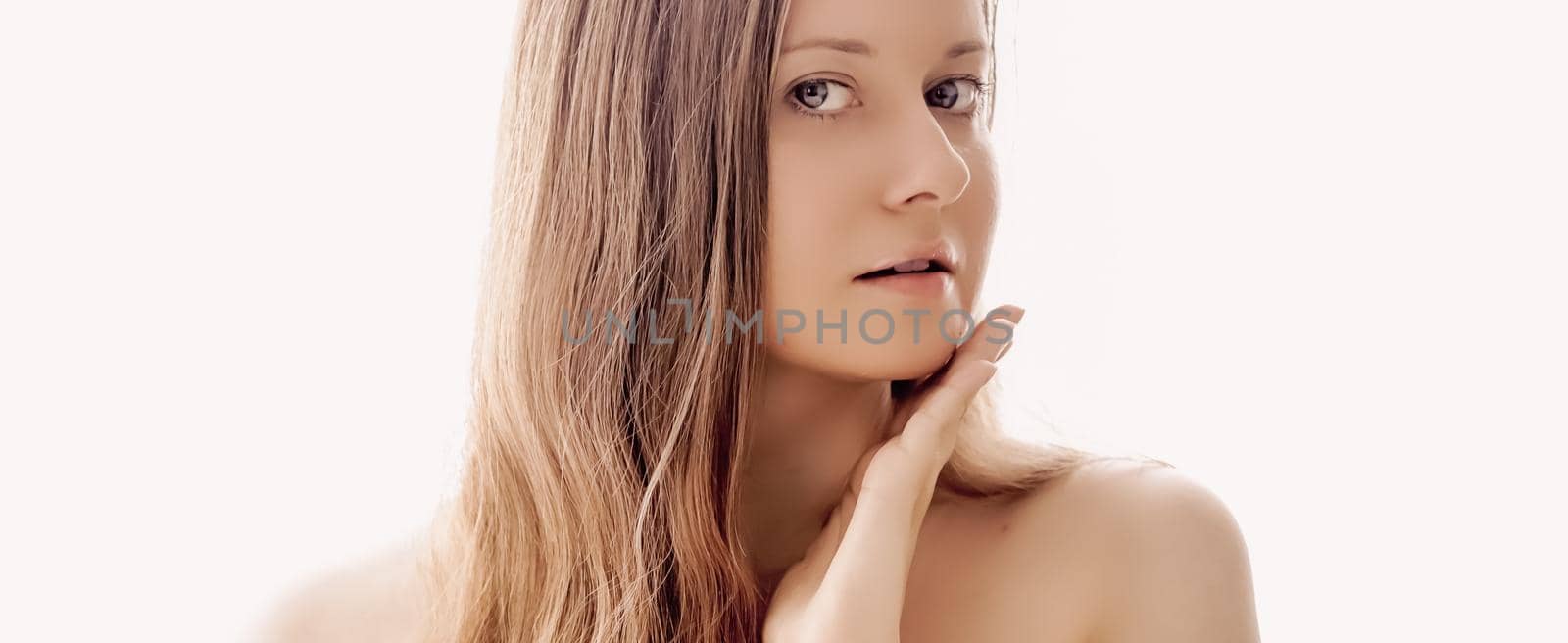 Beautiful woman with natural look, perfect skin and shiny hair as make-up, health and wellness concept. Face portrait of young female model for skincare cosmetics and luxury beauty ad design.