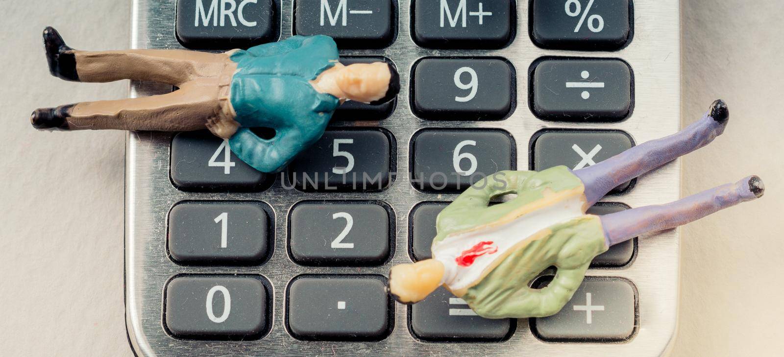Men figurine on Calculator device  with a keyboard and display