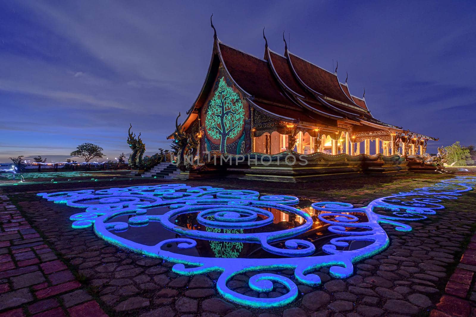 Twilight shot of Sirindhorn Wararam Phu Prao Temple is public Temple in Ubonrachatani, Thailand. by NuwatPhoto