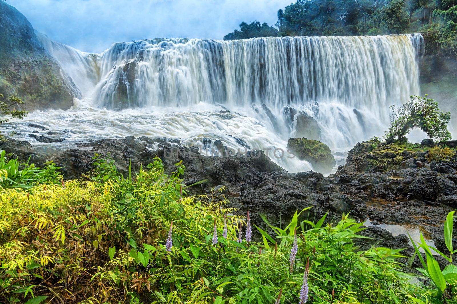 The powerful of Sae Pong Lai waterfall in Southern Laos. by NuwatPhoto