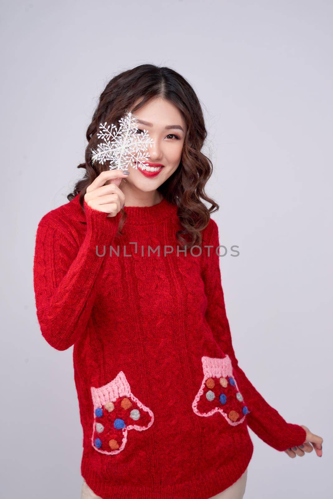 Portrait of beauty winter asian girl in red knitted woolen dress