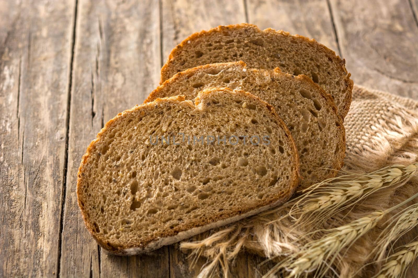 Fresh rye bread on wooden table