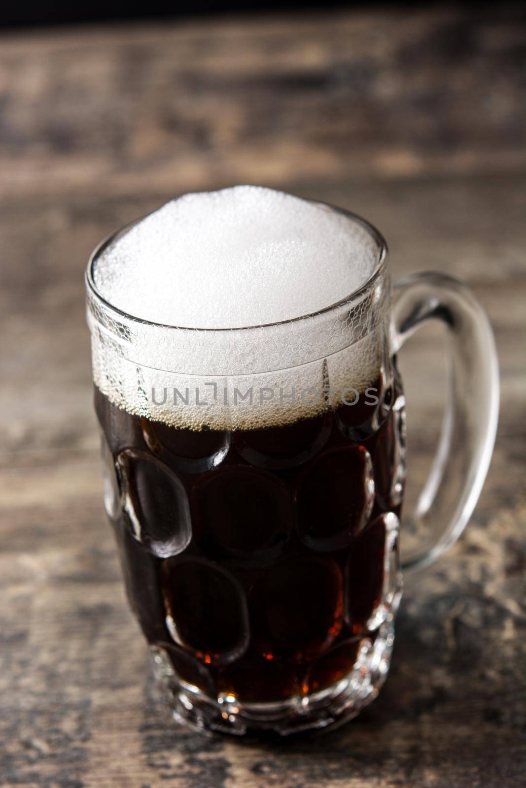 Traditional kvass beer mug on wooden table