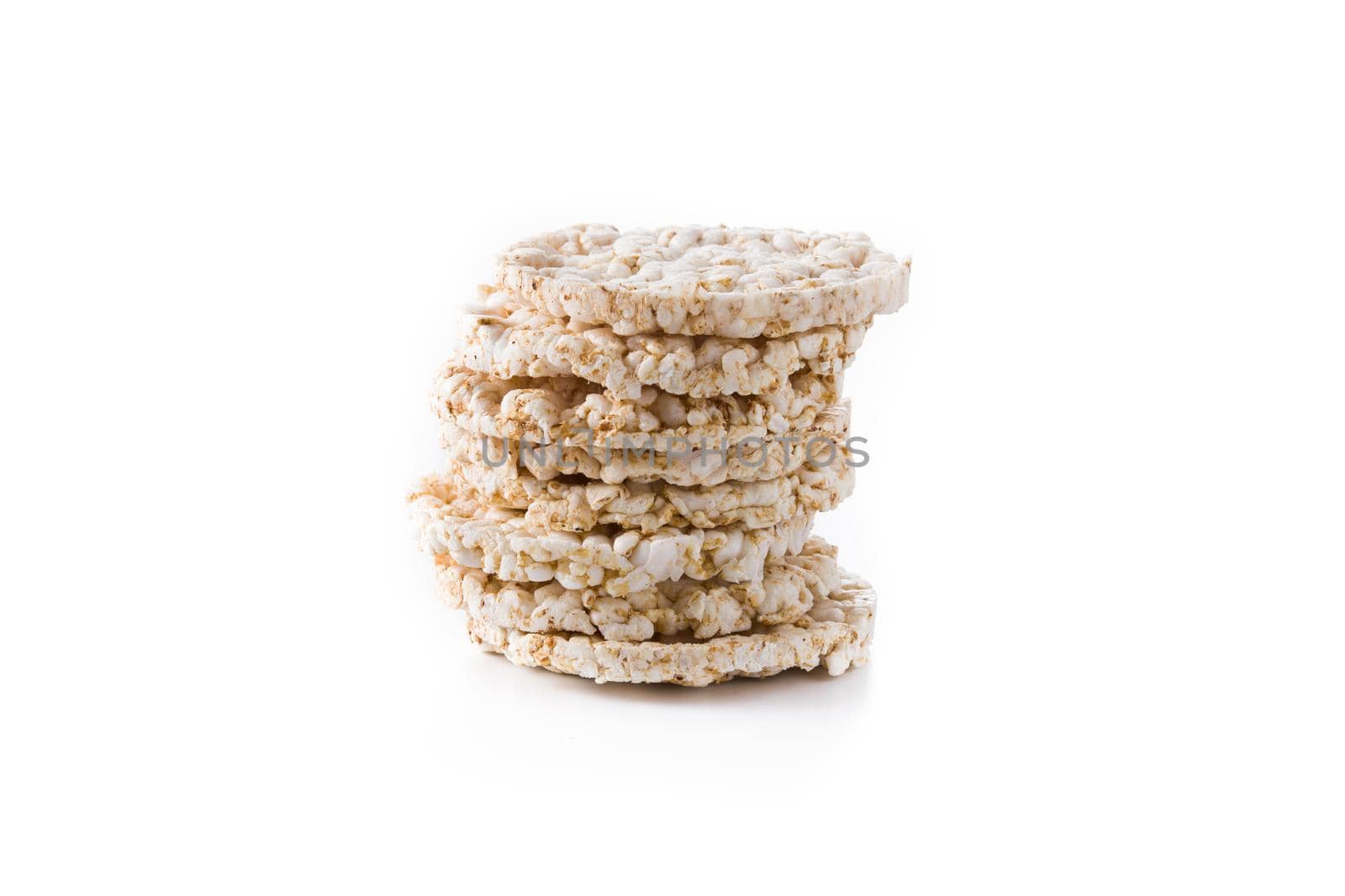 Pile of puffed rice cakes isolated on white background