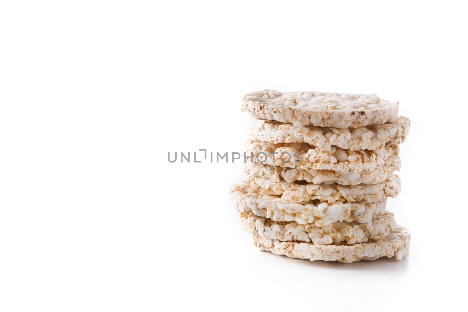 Pile of puffed rice cakes isolated on white background