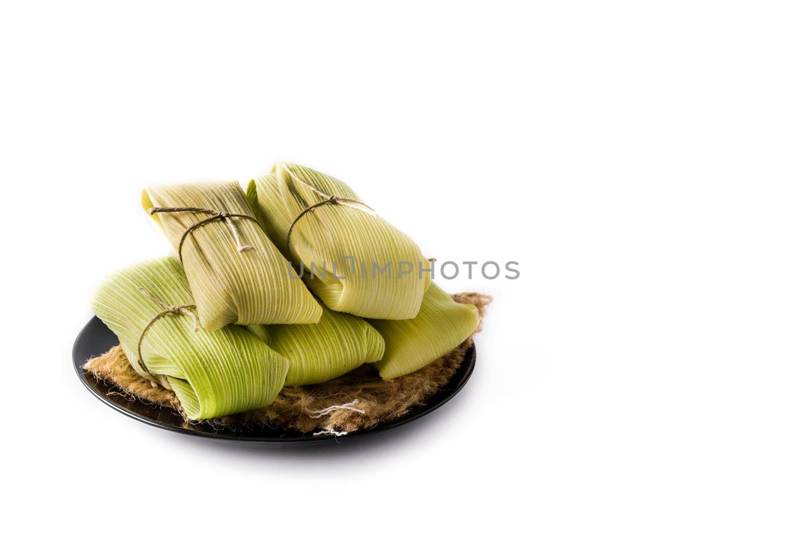 Mexican corn and chicken tamales isolated on white background