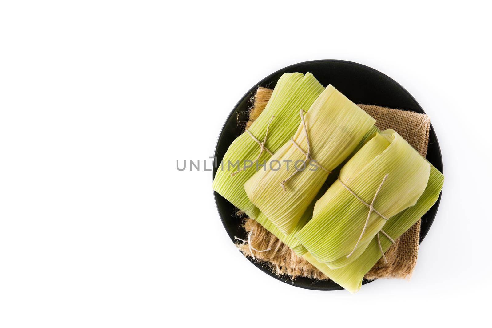 Mexican corn and chicken tamales isolated on white background.